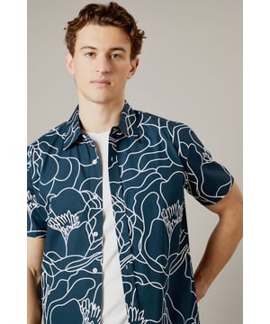 Bold sketch floral pattern creates a distinctive contemporary look
        Short sleeve design perfect for warmer days
        Classic collar with button-through front
        Relaxed fit for comfortable all-day wear
        100% cotton fabric ensures breathability and comfort
    
    Make a statement with this eye-catching Burton sketch floral shirt. The striking linear pattern offers a modern twist on traditional florals, making it an ideal choice for the man who appreciates classic style with a contemporary edge. Pair with neutral chinos as shown for a balanced look that works brilliantly for casual gatherings or weekend pub visits. The breathable cotton construction ensures comfort throughout the day, whilst the versatile design can be worn buttoned up or open over a plain t-shirt for different styling options. Perfect for summer barbecues, casual Fridays at the office, or meeting mates for a pint. This shirt transitions effortlessly from daytime casual to evening socialising - simply add dark jeans and trainers to complete the look. Machine washable at 30 degrees for easy care.