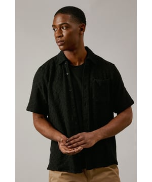 Textured jacquard fabric adds depth and visual interest
        Short sleeves for a cool and casual look
        Classic collar for a smart-casual appearance
        Button-down front for easy wear
        Versatile design suitable for various casual occasions
    
    This Burton short sleeve shirt combines comfort with style, perfect for the man who appreciates classic designs with a modern twist. The jacquard texture adds a subtle sophistication to this casual piece, making it ideal for various settings. Pair it with chino shorts and trainers for a relaxed weekend look, or dress it up with tailored trousers for casual Fridays at the office. The breathable cotton fabric ensures comfort during warmer days or for those after-work drinks at the local pub. Whether you're heading to a family barbecue or meeting mates for a casual dinner, this shirt offers the versatility and ease that every wardrobe needs. Its timeless design makes it a go-to option for the fashion-conscious gent who values both style and practicality in his everyday wear.