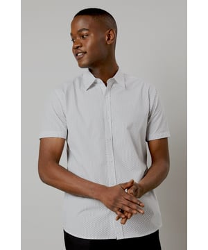 Crafted from pure cotton for exceptional comfort and breathability
        Subtle geo print pattern adds contemporary visual interest
        Classic collar and button-through front for a timeless silhouette
        Short sleeves designed for warm-weather versatility
        Regular fit provides ease of movement for all-day wear
    
    This Burton geo print shirt combines classic styling with modern detailing, perfect for the man who appreciates understated sophistication. The lightweight cotton construction makes it ideal for casual summer occasions, whilst the versatile design allows for effortless styling. Pair with dark trousers as shown for an evening at the pub with mates, or team with chino shorts for family barbecues and weekend outings. The clean lines and subtle pattern work equally well for casual Fridays at the office - simply add a lightweight blazer to sharpen the look. Easy to care for and comfortable to wear, this shirt represents the perfect balance of practicality and style that Burton is known for. A wardrobe essential that will serve you well throughout the warmer months.