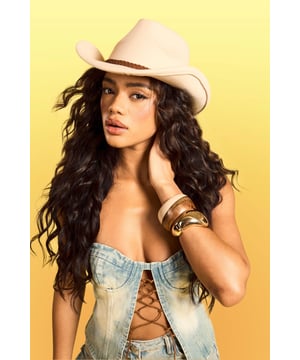 Classic cowboy hat silhouette with a wide brim
        Distinctive braided detail around the crown
        Decorative tassel accent for added flair
        Structured design maintains shape
        Versatile accessory for various casual outfits
    
    Channel your inner cowgirl with this eye-catching Western-inspired hat. The braided detail and playful tassel add a touch of bohemian charm to the classic cowboy silhouette. Perfect for festivals, outdoor events, or simply adding a dash of Wild West flair to your everyday look. Style it with a denim waistcoat and distressed shorts for a carefree summer ensemble, or pair it with a flowing maxi dress for a more romantic take on festival fashion. This hat is not just an accessory; it's a statement piece that will transform your casual outfits into head-turning looks. Whether you're heading to a family barbecue or a day out with friends, this versatile hat will keep you stylish and shaded in equal measure.