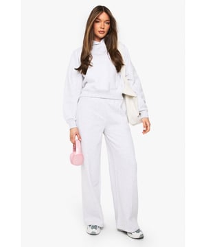 Distinctive pintuck detailing adds texture and visual interest to these straight leg joggers
        Soft fleece-back fabric provides warmth and comfort for all-day wear
        Practical side pockets perfect for keeping essentials close at hand
        Straight leg silhouette offers a modern, relaxed alternative to traditional tapered joggers
        High-rise waistband creates a flattering silhouette that pairs beautifully with cropped tops
    
    These Boohoo pintuck detail straight leg joggers redefine casual comfort without compromising on style. The structured straight leg design creates a more polished silhouette than traditional joggers, making them perfect for those seeking comfort with a fashion-forward edge. Style them as seen with a matching sweatshirt and trainers for an effortlessly coordinated athleisure look, or dress them up with a fitted bodysuit and chunky boots for casual outings. The fleece-back fabric ensures these joggers transition seamlessly from autumn lounging to winter layering. Ideal for weekend coffee runs, casual family gatherings, or relaxed evenings with friends - these versatile joggers will quickly become your go-to for comfortable yet put-together casual ensembles. Pair with oversized knitwear and a puffer jacket when temperatures drop for maximum cosiness.