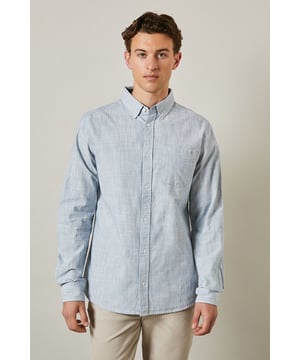 Textured woven cotton fabric for breathable comfort
        Classic button-down collar for a refined casual look
        Convenient chest pocket for practical detailing
        Long sleeves with buttoned cuffs for versatile styling
        Regular fit silhouette suitable for various body types
    
    This Maine textured long sleeve shirt combines timeless design with everyday wearability. The subtle texture adds visual interest whilst maintaining a clean, sophisticated appearance. Style it as seen with neutral chinos and white trainers for a relaxed weekend look, or dress it up with tailored trousers and loafers for smart-casual occasions. The button-down collar keeps everything looking neat, whether worn open over a t-shirt or buttoned up for family gatherings. Made from 100% cotton, this shirt offers natural comfort throughout the day. Perfect for transitional weather, layer under a lightweight jumper or wear solo when temperatures rise. A wardrobe essential that bridges the gap between casual and smart with effortless British style.