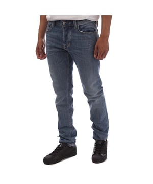 Heren Diesel 1986 Larkee Beex Regular-Fit Jeans in denim.- Gulp met knoop.- Vijf zakken.- Geborduurd Diesel merk.- Taps toelopende pijpen.- Regular fit.- 99% Katoen 1% Elastan.- Ref: 00SU1Y009ZR01