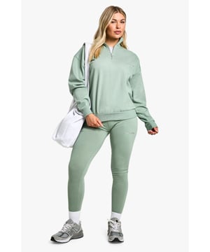 Cosy knitted half-zip sweatshirt and legging set
        Relaxed fit sweatshirt with ribbed cuffs and hem
        High-waisted leggings for a flattering silhouette
        Versatile two-piece ensemble for effortless styling
        Perfect for lounging or casual outings
    
    Embrace comfort without compromising on style with this trendy half-zip sweatshirt and legging set from Boohoo. The relaxed fit sweatshirt features a practical half-zip design, allowing you to customise your look and adjust for temperature. Pair with the matching high-waisted leggings for a coordinated outfit that's both fashionable and functional. This set is ideal for those lazy weekend mornings, running errands, or meeting friends for a casual coffee date. Style with chunky trainers and a crossbody bag for an on-trend athleisure look, or dress it up with ankle boots and a leather jacket for a more put-together ensemble. The versatility of this set makes it a wardrobe essential for the fashion-forward woman who values both comfort and style in her everyday wear.