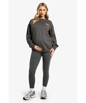 Comfortable maternity hoodie and leggings set
        Relaxed fit hoodie with 'In My Mom Era' slogan
        Stretchy leggings for growing bump
        Versatile for lounging or light exercise
        Soft cotton blend fabric for all-day comfort
    
    Embrace your journey into motherhood with this chic and cosy maternity tracksuit set. The relaxed-fit hoodie features a playful 'In My Mom Era' slogan, perfect for showcasing your new status with pride. Paired with stretchy leggings that accommodate your growing bump, this set offers supreme comfort for your changing body. Whether you're heading to a prenatal yoga class or simply relaxing at home, this versatile ensemble has got you covered. Style it with trendy trainers and a roomy tote for a quick coffee run, or layer with a denim jacket for a casual day out. The soft cotton blend fabric ensures all-day comfort, making this set an essential addition to your maternity wardrobe. It's the ideal choice for the fashion-forward mum-to-be who wants to stay on-trend while prioritising comfort during this special time.