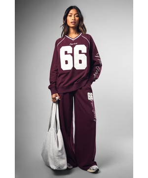 Wide-leg design for ultimate comfort and style
        Bold '66' graphic print on leg
        Coordinating sweatshirt available for a matching set
        Relaxed fit perfect for lounging or casual outings
        Versatile piece that can be dressed up or down
    
    Make a statement in these eye-catching Dsgn Sport 66 wide-leg joggers from Boohoo. Perfect for the fashion-forward woman who values both style and comfort, these joggers offer a relaxed fit with a trendy wide-leg silhouette. The standout '66' graphic print adds a sporty edge, whilst the soft cotton blend fabric ensures all-day comfort. Style these versatile joggers with the matching sweatshirt for a coordinated look, or mix and match with a cropped tee and trainers for a more casual vibe. Ideal for lazy weekends, running errands, or meeting friends for coffee, these joggers effortlessly blend athleisure with street style. For a more polished look, pair with a fitted bodysuit and chunky jewellery. Whatever the occasion, these Dsgn Sport 66 joggers are sure to become a go-to piece in your wardrobe.