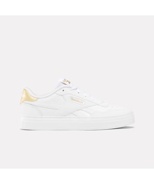 Womens Reebok Classics Court Advance Clip Trainers in white - gold.All the Reebok court design you love. These shoes mash up the icons Club C 85 and Club C Revenge to make the new Court Advance. The tennis-inspired low-top silhouette features a sleek panelled upper with a contrast heel clip and classic windowbox. Foam cushioning and DMX bubbles at the sole provide all-day comfort.- Synthetic upper.- Lace-up front fastening.- Padded ankle collar and tongue.- Perforated toe box.- Reinforced toe cap.- Logo at heel and windowbox.- Logo tab at tongue.- EVA foam midsole with debossed stripes.- DMX Microbubbles in midsole.- Rubber outsole.- Ref: 100207971