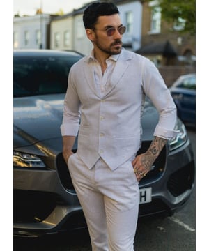 Embrace effortless summer sophistication with this grey 2-piece linen suit, designed with comfort and style in mind. Featuring a coordinating waistcoat and trousers, this ensemble is ideal for warm-weather occasions. The lightweight and breathable linen blend keeps you cool and comfortable, even on the hottest days. With its relaxed yet refined appearance, this suit strikes the perfect balance between smart and casual—ideal for garden parties, destination weddings, or daytime events. Whether dressed up with a crisp shirt or styled casually with loafers, this suit adapts easily to your look and lifestyle.\n2-piece set includes waistcoat and trousers in a light grey tone\nLightweight and breathable fabric perfect for summer events\nRelaxed yet stylish look, ideal for casual weddings or garden parties\nVersatile styling—elevate with formalwear or dress down for smart-casual looks\nMaterial: 80% Cotton, 20% Acrylic