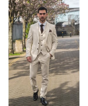 Embrace effortless sophistication with this beige 3-piece linen suit, designed with comfort and style in mind. Featuring a coordinating jacket, waistcoat and trousers, this ensemble is ideal for warm-weather occasions. The lightweight and breathable linen blend keeps you cool and comfortable, even on the hottest days. With its relaxed yet refined appearance, this suit strikes the perfect balance between smart and casual—ideal for garden parties, destination weddings, or daytime events. Whether dressed up with a crisp shirt or styled casually with loafers, this suit adapts easily to your look and lifestyle.\n3-piece set includes Jacket, waistcoat and trousers in a light beige tone\nLightweight and breathable fabric perfect for summer events\nRelaxed yet stylish look, ideal for casual weddings or garden parties\nVersatile styling—elevate with formalwear or dress down for smart-casual looks\nMaterial: 80% Cotton, 20% Acrylic - Note : The trouser waist is 6 inches smaller than the corresponding jacket/waistcoat size. For example, a 34'' jacket/waistcoat + 28'' trouser, a 36'' jacket/waistcoat + 30'' trouser, 38'' jacket/waistcoat + 32'' trouser, a 40'' jacket/waistcoat + 34'' trouser, 42'' jacket/waistcoat + trouser 36, 44'' jacket/waistcoat + trouser 38, 46'' jacket/waistcoat + trouser 40, 48'' jacket/waistcoat + trouser 42, 48'' jacket/waistcoat + trouser 44, and 52'' jacket/waistcoat + 46'' trouser.
