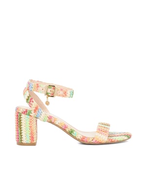Embolden your favourite edits with this chic sandal. Fitted with a slender buckled ankle strap with a delicate chain. It rests on a contrasting mid block heel.