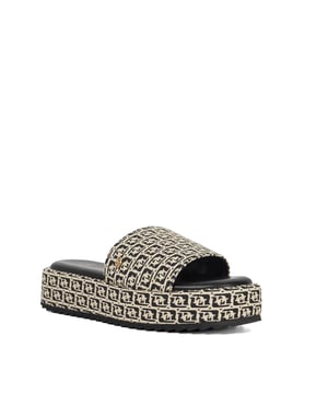 Upgrade your casual look with Lanie, statement sliders decorated in an all-over Dune London monogram print. Adorned with subtle gold-tone branding, these slip-ons are designed for ultimate comfort and standout style. The flatform sole adds some height, making them perfect for all-day wear.