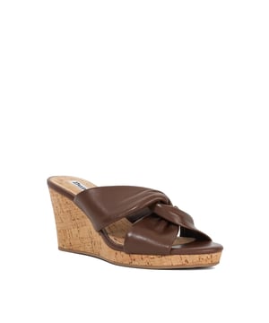 Wedge heels are the season's trendiest way to ease back into dressing up again, and Kacee is the epitome of the style. Crafted from the finest material, the upper of our wedge heeled mule culminates in two wide straps that are finished with knot detailing, enhancing the look. Set on a lightweight cork sole for ease of wear, this round-toed silhouette will team with everything from denim to sundresses alike.