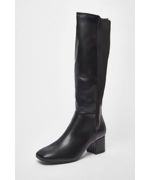 - Faux leather finish - Knee high - Low block heel - Elasticated fabric section - Inside zip - Heel height: 5.5cm / 2.2inches