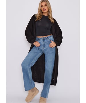 Hüllen Sie sich in Luxus mit unserem Black Chunky Knit Long Cardigan. Sie ist aus einem weichen und kuscheligen Stoff gefertigt und perfekt für kühlere Tage. Genießen Sie die Eleganz und Raffinesse unseres Premium-Produkts, das für Menschen mit einer Vorliebe für die feineren Dinge des Lebens entworfen wurde.