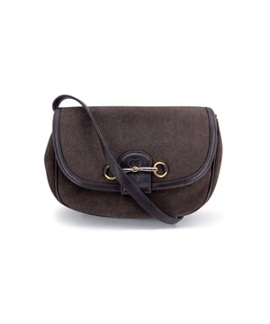 VINTAGE, RRP AS NEW
A Timeless Treasure: Vintage Gucci Horsebit Stingray Shoulder Bag  Step into quiet luxury with this stunning vintage Gucci Horsebit shoulder bag - a model that captures the essence of equestrian-inspired elegance and enduring craftsmanship. Rendered in rare brown stingray leather, its distinctive texture is paired beautifully with smooth brown leather trim and an adjustable shoulder strap, creating a structured silhouette that's both refined and bold.  The hallmark Horsebit motif, a signature of Gucci's heritage, gleams in gold and silver metal at the front, flanked by half-horsebit accents on each side - subtle nods to the brand's equestrian roots. The front flap opens with a magnetic snap to reveal a rich brown suede interior, complete with a side zip pocket for essentials.  Labeled 'GUCCI - Made in Italy' with a serial number discreetly tucked behind, this piece is more than a bag - it's a collectible slice of Gucci history. A rare model, perfect for the discerning collector or anyone drawn to the legacy of Italian design. Condition Rating: B - VERY GOOD CONDITIONCondition Details: Gently used. Some normal wear of use. Some normal wear of use inside. Please check the photos carefully and ask if you need to know more details or if you have any doubts.Measurements (cm):Depth: 3.8Height: 16.5Length: 21.6Other Details: Dustbag? NoKeys? NoBox? No Measurments:  width: 38 mm length: 216 mm height: 165 mm