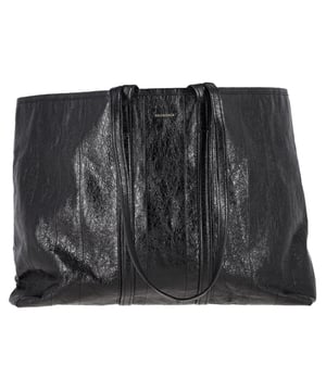 VINTAGE, RRP AS NEW
The Balenciaga Large Barbes East West Tote Bag in Black Lamb Leather combines timeless luxury with everyday functionality. Crafted from premium black lamb leather, this spacious tote features sleek, minimalist lines and a subtly embossed logo for an understated yet sophisticated look. Its generous interior makes it ideal for carrying all your essentials, while the durable leather ensures longevity and style. Pair it with a sharp blazer and tailored pants for a polished office look, or use it to complement a casual chic outfit with jeans and a cozy sweater.

Balenciaga Large Barbes East West Tote Bag in Black Lamb Leather

Condition: Very good
Signs of wear: No retail tag, Minor sign of wear or markings., Lightly used but very well maintained. Minor creasing, light worn corners, light scratches.
Packaging: Dust bag
Color: Black
Material: Leather | lambskin leather
Size: One Size | One Size
Measurements: Width: 160; Height: 410; Length: 630; Handle drop: 370; Strap length: 820
SKU: BADOGBBA463415W