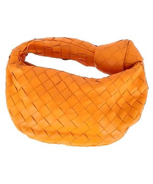 VINTAGE, RRP AS NEW
The Bottega Veneta Mini Jodie in vibrant orange intrecciato leather is the ultimate expression of compact luxury. Its sculptural silhouette and signature woven design make it instantly recognizable, while gold-tone hardware and calfskin lining add refined detail. This top-handle bag is made for effortless impact, from brunch dates to evenings out.

with dust bag

Bottega Veneta Mini Jodie in Orange Leather
Condition: Very good
Signs of wear: No retail tag, Minor sign of wear or markings., Lightly used but very well maintained. Minor creasing, light worn corners, light scratches.
Packaging: Dust bag
Color: Orange
Material: Leather | leather
Size: One Size | One Size
Measurements: Width: 260; Height: 200; Length: 250; Handle drop: 240; Strap length: 0
SKU: NAPPUGBBA475928W