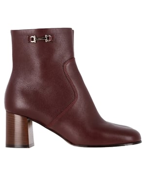 VINTAGE, RRP AS NEW
Step confidently into the new season with Ferragamo’s Otello ankle boots, a sophisticated take on everyday footwear. Crafted in rich burgundy calf leather, these boots feature an elegant almond toe and a decorative metal buckle that adds just the right amount of polish. A side zip fastening ensures ease, while the mid block heel offers all-day comfort with subtle elevation.


Ferragamo Otello Buckle-Detail Ankle Boots in Burgundy Leather
Condition: very good
Signs of wear: No visible sign of wear. No Mark at insole.,  Very light mark at soles.
Packaging: Dust bag
Color: burgundy
Material: Leather 
Size: UK | 6
Measurements: Heel height: 60; Insole length: 270
SKU: NAPPUGBSH475871W