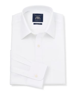 Crafted from cotton and finished with a curl-resistant collar and single cuffs, this is the perfect white work shirt. It'll look great with a navy or grey suit, but will work just as well on its own with some formal trousers. 100% BCI smooth cotton poplin; silk protein easy-care finish. Generously proportioned classic fit. Curl resistant Windsor collar, with an integral and removable collar stay. Pucker-free french taped armhole seams. Split yoke, long tails, chest pocket. Machine washable at 40°C. Presented in fully recyclable packaging.