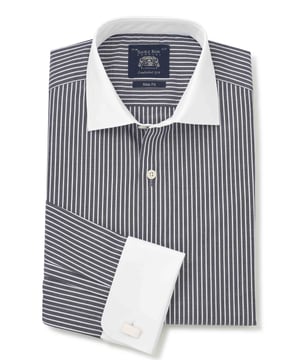 Whether you're taking a client for lunch or celebrating a family wedding, our contrast collar shirts will help you make a stylish impression. This version comes in a navy stripe design in a slim fit shape that flatters all builds. Wear it with a blue suit and your favourite pair of cufflinks. 100% BCI smooth cotton poplin; silk protein easy-care finish. A flattering, gently tapered fit for all builds. Curl resistant cutaway collar, with an integral and removable collar stay. Pucker-free french taped armhole seams. Contrast white double cuff and collar. Split yoke, two back darts. Machine washable at 40°C. Presented in fully recyclable packaging.