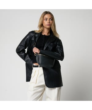 Crafted from premium black real leather with elegant gold-tone trims, this versatile bag is designed for everyday wear. Featuring an adjustable strap, it can be worn comfortably as a cross body or styled around the waist for hands-free convenience. Compact yet functional, it’s the perfect blend of practicality and polished style.