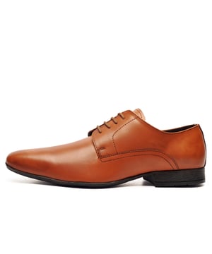 Catesby England was founded in 1970 with a vision and dedication focused on quality, craftsmanship, and a fine attention to detail. From its modest beginnings in a countryside workshop, Catesby England grew into a name synonymous with classic English footwear, blending heritage with modern craftsmanship, manufactured from the finest leathers to ensure durability, comfort, and effortless style.
 The Catesby Cottingham is a sophisticated and stylish shoe that can be worn both casually and formally. These timeless mens shoes boast sleek styling that fuses a premium leather upper with clean lines and a classic silhouette. These Catesby Cottingham shoes offer a stylish and sophisticated design that would be a perfect new addition to your footwear collection.
 
 - Premium leather upper
 - 4 hole lace up closure
 - Cushioned insole
 - Slim durable outsole
 - Raised heel
 - Catesby England branding