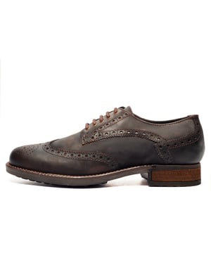 Catesby England was founded in 1970 with a vision and dedication focused on quality, craftsmanship, and a fine attention to detail. From its modest beginnings in a countryside workshop, Catesby England grew into a name synonymous with classic English footwear, blending heritage with modern craftsmanship, manufactured from the finest leathers to ensure durability, comfort, and effortless style.
 Where timeless elegance meets rugged practicality. The SE Catesby Appleby Brogues blend traditional brogue craftsmanship with a modern, outdoor-ready design. Crafted from premium leather, these shoes feature classic wingtip and brogue detailing for a refined aesthetic, while the robust rubber sole delivers superior grip and durability across varied terrains.
 Whether you're navigating city streets or country lanes, the Appleby ensures all-day comfort with its lace-up closure for a secure, adjustable fit. The addition of a wooded heel lends a touch of sophistication and stability, making these brogues a versatile choice for both smart-casual and formal wear.
 - Premium Waxy Leather upper
 - Brogue Detailing
 - Lace-Up Closure
 - Soft textile lining
 - Durable rubber sole
 - Catesby branding
 
 Please Note: These brogues have a dull vintage waxed finish. This is part of the new quality make up of the shoe and is not a fault. There may also be a stickly effect around the welt of the shoe which will wipe clean with a finger or smooth damp cloth. This is nothing more than residue which has been caused by humidity or storage during transportation.