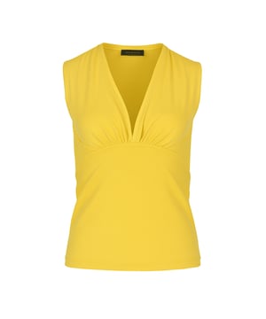 Ilumina tu guardarropa con este elegante top amarillo sin mangas con cuello en V, confeccionado con una mezcla de punto de algodón y elastano suave y transpirable. Diseñado para un ajuste elástico cómodo, este top ofrece un equilibrio perfecto entre estructura y flexibilidad. El elegante escote en V y el suave detalle fruncido crean una silueta favorecedora, lo que lo convierte en un básico versátil para cualquier ocasión. Ya sea vestido con pantalones entallados o con un estilo informal con mezclilla, este top es una adición sencilla a tus elementos esenciales del día a día. Perfecto para días cálidos o para usar debajo de blazers y cárdigans.