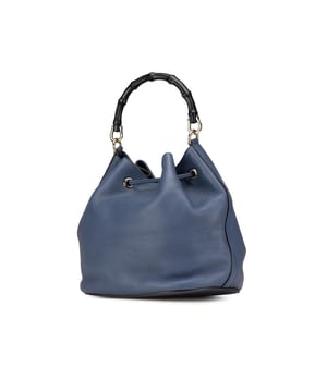 This bucket bag features a leather body a bamboo top handle a detachable chain strap a top drawstring closure with fringe details and interior slip pockets.Brand: GucciCondition: Pre-lovedType: Bucket BagRating: ABMain Material: LeatherDimensions (LxWxD): 27x27.5x19.5Strap Drop: 50Handle Drop: 18Comments: Exterior Bottom Scratched. Exterior Handle Cracked Scratched Worn. Interior Lining Scratched Worn. Interior Lining stained with Other. Practical Attachment Scratched. Exterior Top Worn.