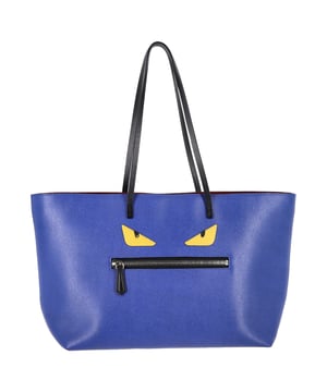 VINTAGE, RRP AS NEW
The Fendi Medium Monster Roll Tote Bag in blue leather makes a playful luxury statement with its iconic monster eyes motif and structured silhouette. Crafted from supple, high-quality leather, it offers ample space and standout style for both everyday use and travel. Style tip: Carry it with a sleek monochrome outfit to let the bold design shine, or mix with other vibrant accessories for a confident, fashion-forward look.

 Fendi Medium Monster Roll Tote Bag in Blue Leather

Condition: Excellent
Signs of wear:  No visible sign of wear
Packaging: None
Color: Blue | blue
Material: Leather | leather
Size: One Size | One Size
Measurements: Width: 140; Height: 270; Length: 500; Handle drop: 240; Strap length: 640
SKU: NAPPUGBBA480616W