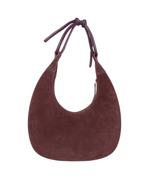 Make a statement with this unique circular shoulder bag from Barneys Originals, crafted from rich burgundy suede with premium leather detailing. The structured design helps the bag retain its shape, while the soft leather tie strap offers a touch of effortless elegance. Finished with a sleek gold zip closure, this bag is a standout piece that adds depth and texture to any outfit – perfect for both everyday use and special occasions.
