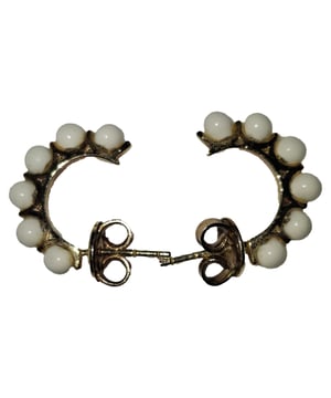 VINTAGE, RRP AS NEW
Bottega Veneta’s Small Enamel Hoop Earrings strike the perfect balance between understated elegance and contemporary detail. Crafted in gold-tone metal, these petite hoops are accented with smooth white enamel beads, adding a subtle contrast and textural interest. Lightweight and versatile, they’re a refined choice for everyday wear or minimalist evening styling.


Bottega Veneta Small Enamel Hoop Earrings in Gold Metal
Condition: Very good
Signs of wear: Lightly used but very well maintained, May show wear such as minor scratches, nicks and/or dents. Minor tarnishing.
Packaging: None
Color: White and gold
Material: Metal 
Size: One Size | One Size
Measurements: Width: 15; Height: 20
SKU: NAPPUGBJE480602W