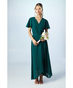 Elegant waterfall wrap design
        Flattering V-neckline
        Delicate georgette fabric
        Flutter sleeves for a feminine touch
        Maxi length for a sophisticated silhouette
    
    This enchanting bridesmaids dress from Coast radiates grace and sophistication. Perfect for the bridal party, it features a flattering wrap style that drapes beautifully over the figure. The flowing georgette fabric moves with ethereal elegance, while the flutter sleeves add a touch of whimsy. The V-neckline frames the dcolletage beautifully, and the maxi length ensures a refined look as you glide down the aisle. Style with delicate strappy sandals and subtle jewellery to complement the bride's ensemble. This dress is designed to make you feel confident and poised as you stand beside the bride on her special day, harmonising perfectly with the wedding's colour palette and overall aesthetic.