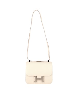 VINTAGE, RRP AS NEW
Timelessly elegant and exceptionally rare, the Hermès Constance Bag in Beton Evercolor leather is a handcrafted masterpiece that epitomizes quiet luxury. Designed with sleek, architectural lines, this piece features the refined structure of Evercolor leather—soft to the touch, yet resilient—with a delicate grained texture that elevates its understated tone. The luminous Beton hue, a sophisticated off-white, is perfectly complemented by palladium-plated hardware and the iconic 'H' clasp closure. An emblem of prestige and impeccable craftsmanship, this Constance is more than a bag—it's an heirloom in the making.


with Box, Dust bag

Hermès Beton Evercolor Palladium Plated Constance Bag in White Leather
Condition: Excellent
Signs of wear: No retail tag, No visible sign of wear., 
Packaging: Box, Dust bag
Color: White | ecru
Material: Leather | sheep leather
Size: One Size | One Size
Measurements: Width: 70; Height: 190; Length: 230
SKU: NAPPUGBBA469793W