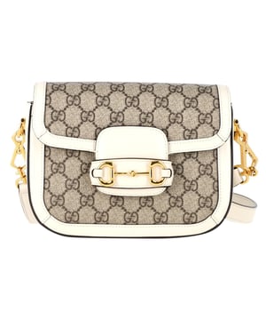 VINTAGE, RRP AS NEW
 Embrace timeless elegance with the Gucci Horsebit 1955 Mini Shoulder Bag in White Leather and Canvas. A luxurious blend of cream white leather and GG Supreme canvas, this mini shoulder bag features the iconic Horsebit detail at the front, a signature element of Gucci's heritage. The foldover top opens to reveal a spacious main compartment, perfect for storing your essentials with style. Finished with the a tonal adjustable strap and gold-tone hardware, this bag combines classic sophistication with modern functionality. Whether you're dressing up for a night out or adding a touch of luxe to your casual look, the Gucci Horsebit 1955 mini bag is a statement piece you'll cherish for years.

with Dust bag

Gucci Horsebit 1955 Mini Shoulder Bag in White Leather and Canvas
Condition: Excellent
Signs of wear: No retail tag, No visible sign of wear., 
Packaging: Dust bag
Color: White | ecru
Material: leather and Canvas | coated/waterproof canvas
Size: One Size | One Size
Measurements: Width: 50; Height: 150; Length: 200
SKU: NAPPUGBBA461255W