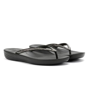 Waterproof ergonomic flip-flops with a durable rubber upper and anatomically shaped straps for a secure fit adorn with micro-crystals . Designed with a contoured footbed to support natural alignment and reduce toe gripping. Lightweight, flexible, and perfect for beach days, poolside lounging, or everyday summer wear.