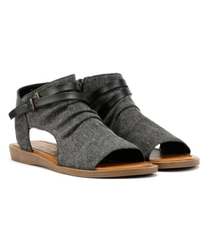 Sandals featuring a breathable textile upper for lightweight comfort. Designed with an open toe silhouette and zip fastening for easy on and off wear. Ethically made vegan footwear ideal for warm-weather styling.