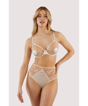 She's brand new.. her name's Cassia Ivory. Featuring delicate custom embroidery, this quarter cup ivory bra is a detailed dream with sexy satin edge.Pair her with the dazzling diamante Cassia Nipple Pasties for a finished look..

Scalloped edges
Hook and eye closure at the back
Satin band
Adjustable straps
Blue satin piping
Custom embroidery 