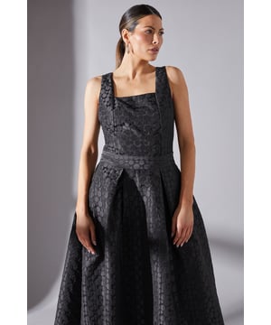 Elegant square neckline for a sophisticated look
        Sleeveless design perfect for warm-weather occasions
        Textured spot jacquard fabric adds depth and interest
        Fitted bodice with a flattering pleated waist
        Midi length skirt with a graceful A-line silhouette
    
    This stunning Wallis co-ord top radiates sophistication and charm, making it an ideal choice for a variety of formal occasions. The square neckline frames the dcolletage beautifully, while the sleeveless design keeps you cool and comfortable during warm-weather events. The textured spot jacquard fabric adds a touch of luxury and visual interest to the ensemble. With its fitted bodice and pleated waist, this top creates a flattering silhouette that accentuates your curves. Style it with the matching skirt for a coordinated look, or pair it with tailored trousers for a chic alternative. Accessorise with delicate jewellery and strappy heels to complete your polished outfit, perfect for weddings, races, or any event where you want to make a stylish statement.