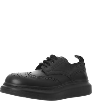 Alexander Mcqueen Lace Ups
       • Brand: Alexander Mcqueen
       • Material: 100%Calf
       • Design: These lace-up shoes exude luxury and sophistication, crafted from high-quality 100% calf leather. The design is sleek and minimalist, featuring a smooth black leather upper that offers both a polished and contemporary look. The clean lines and subtle details, such as embossed branding on the heel or tongue, add to the understated elegance. The lace-up closure allows for a secure fit, while the leather construction ensures durability and a refined finish
       • Colour: Black
       • Style: The Alexander McQueen Lace Ups in black are ideal for those who appreciate a blend of luxury and versatility. The sleek and minimalist design allows for easy pairing with everything from tailored suits and trousers to more casual, refined looks