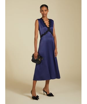 Description\nDate nights are made easy with a chic, lingerie-inspired slip dress. The Marcella Midi Dress is cut with a v-shaped seam under the bust for the most flattering fit, finished with a pretty lace trim. It skims the body before gently flaring out, and we’ve added a discreet panel of elastication to the back waist for maximum comfort. Cut from responsibly-sourced Ecojilin satin, it’s one to swish the night away in!\n\nMade in Europe\nCrafted in Ecojilin blend\nFastens with a concealed side zip\nMidi length\n\n\nSustainable Attributes:\n  Low Water Use   Recycled Fibres   Ethically made\nDetails\nModel is 5'10 (177cm) and is wearing a UK 1055% Ecojilin, 45% Commercial JilinDry Clean OnlyWash Inside Out - Wash Dark Colours SeparatelyProduct Code: DR40587-DPIBack shoulder at neck to hem - 122cm (48)