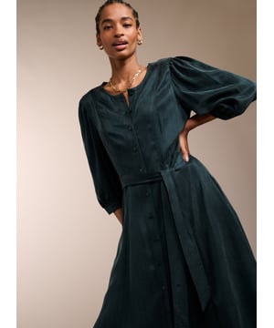 Description \n\nWhether it’s for brunch or work, you’ll feel ready for anything in Malin. This midi in recycled Cupro feels silky against the skin, and boasts a soft sheen in gorgeous green. It buttons all the way through and skims the waist to flatter. Tie with the self belt or a contrasting leather. It goes effortlessly with knee-high boots, loafers or mary-janes.  \n\n \nMade in Europe\n\nCrafted in recycled Cupro   \n\nPockets in side seams  \n\nCo-ordinating self-tie belt  \n\nElbow-length sleeves  \n\nSingle button cuffs  \n\n \n\n \n\nSustainable Attributes: \n\n Low Water Use   Recycled Fibres  Ethically made  \n\n \n\nDetails \n\n Model is 5'10 (177cm) and is wearing a UK 1053% Recycled Cupro, 47% Ecovero ViscoseDelicate Machine Wash 30˚Product code: DR40572-DAG Back shoulder at neck to hem - 119cm (46 7/8)Sleeve length - 48cm (18 7/8)