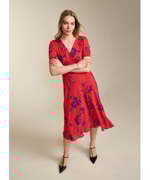 Description\nFits true to size, we suggest ordering your usual size.\nWith Kaydence, occasionwear is made easy. This chic midi will see you through weddings and christenings in unique style thanks to the unexpected pairing of a purple floral print on a bold red base. And then there’s the cut: wafty and A-line and slim through the waist with an under-the-bust seam. Prepare to turn heads!\n\nMade in Europe\nCrafted in LENZING™ ECOVERO™ crepe\nFastens with an invisible centre-back zip\nMidi length\nV-shape neckline\n\n\nSustainable Attributes:\n  Low Water Use  Ethically made  Vegan   \nDetails\nModel is 5'10 (177cm) and is wearing a UK 10100% LENZING™ ECOVERO™ ViscoseDelicate Machine Wash - 30°Product code: DR40614-RANBack shoulder at neck to hem - 124cm (48 7/8)Sleeve length - 27cm (10 5/8)