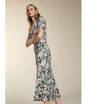 Description\nFits true to size, we suggest ordering your usual size.\nWith Kaydence, occasionwear is made easy. This chic midi will see you through weddings and christenings in unique style thanks to the unexpected pairing of a purple floral print on a bold red base. And then there’s the cut: wafty and A-line and slim through the waist with an under-the-bust seam. Prepare to turn heads!\n\nMade in Europe\nCrafted in LENZING™ ECOVERO™ crepe\nFastens with an invisible centre-back zip\nMidi length\nV-shape neckline\n\n\nSustainable Attributes:\n  Low Water Use  Ethically made  Vegan   \nDetails\nModel is 5'10 (177cm) and is wearing a UK 10100% LENZING™ ECOVERO™ ViscoseDelicate Machine Wash - 30°Product code: DR40614-RANBack shoulder at neck to hem - 124cm (48 7/8)Sleeve length - 27cm (10 5/8)