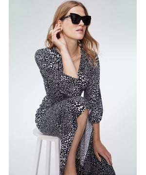 Description\nFits true to size, we suggest ordering your normal size.\nVersatile and dependable, a wrap dress is a timeless staple which every wardrobe needs. Our Judy style is crafted from sustainably-sourced stretch jersey, so it hugs the body in all the right places and makes for the most comfortable fit. The textured spot print is unbelievably hard-working. From desk to dinner; dress it up with slingbacks for nights out, or down with crisp white sneakers for weekend brunches.\n\nCrafted in LENZING™ ECOVERO™ jersey\nFunctional wrap style\nMidi length\nThree-quarter length sleeves\n\n\nSustainable Attributes:\n Made in Europe   Low Impact  Low Water Use Ethically made   Vegan   Low Carbon  \n\nDetails\nModel is 5'10 (177cm) and is wearing a UK 1095% LENZING™ ECOVERO™ Viscose, 5% ElastaneDelicate Machine Wash - 30°Product code: DR40525-BTXBack shoulder at neck to hem - 120cm (47 1/4)Sleeve length - 48cm (18 7/8)