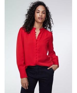 Description\nFits true to size, we suggest ordering your normal size.\nWhat our customers say: This is a beautiful blouse, and the material is really soft.\nWhether it’s for work or dinner, the Annika will instantly add a touch of feminine elegance to your looks. It comes with pretty, rouleau loop button fastenings, gathered shoulders and deep cuffs with pleated details on the outer section for that extra detail. It comes in a relaxed fit so it can easily be tucked in. This is a stunning blouse you will enjoy for years.\nChic and stunning - Baukjen\n\nMade from eco-friendly TENCEL™\nButton-through\nRelaxed fit\n\n\nSustainable Attributes:\n Made in Europe  Low Water Use Ethically made   Vegan  \n\nDetails\n100% LENZING TENCEL™ Delicate Machine Wash - 30°Product Code: SH40164-CRDBack shoulder at neck to hem - 65cm (25 5/8) Sleeve length - 64cm (25 1/4)