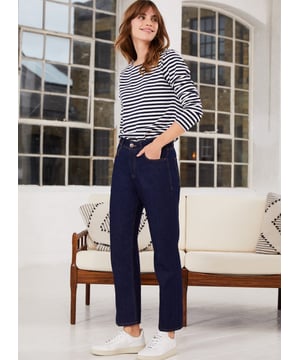 Description\nIf you are looking for a change from skinnies but want to keep to a jean that will work in more formal environments too, this sturdy, non-stretch style with a pleated front, ticks every box.” - Katherine Ormerod\nThe search for simple, straight-leg ankle-grazing jeans ends with Adelaide. The dark indigo wash lends a smart, elegant feel and the fit is equally as considered: fitted through the waist and hips they are topped with a crease down the front of the legs. Note that this style is non-stretchy, and omitting elastane is much kinder to the planet.\n\nCrafted from premium organic cotton\nStraight leg shape\n\nRigid denim texture\n\nSmart staple\n\n\nSustainable Attributes:\n Made in Europe   Natural fibres    Organic Ethically made   Vegan \n\nDetails\n100% Organic CottonMachine Wash - 40°Product code: TR40224-DINInside leg - 67cm (26 3/8)