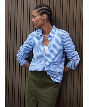 Description\nFits true to size, we suggest ordering your usual size.\nA crisp shirt is so versatile, there’s no such thing as having too many! We’ve created Rishma in organic cotton and classic, light blue and white stripes. With a borrowed-from-the-boys fit, it looks chic half-tucked into any style of trouser, dark and white jeans included.\n\nMade in Europe\nCrafted in organic, yarn-dyed cotton shirting\nSlightly oversized fit\nDeep cuffs\n\n\nSustainable Attributes:\n  Natural fibres    Organic   Ethically made  Vegan \n\nDetails\nModel is 5'10 (177cm) and is wearing a UK 10100% Organic Cotton Delicate Machine Wash - 40°Product code: SH40259-BSWBack shoulder at neck to hem - 73cm (28 3/4)Sleeve length - 60cm (23 5/8)