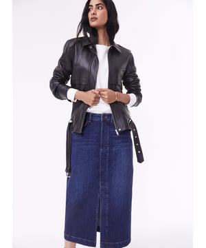 Description\nFits true to size, we suggest ordering your usual size.\nThe hot-ticket item right now according to our Design Director Natalie. A long-line denim skirt. In organic cotton of course. Emilia is a cool alternative to jeans, with a split up the front for a flash of leg and easy movement. It’s a versatile piece which hugs the waist and hips before tapering out into a chic column shape. So versatile, you can dress it up with loafers and a shirt, or down with a sweater and sneakers.\n\nCrafted in organic cotton denim\nLong midi length\nFront split detail\nZip button and fly fastening\nClassic jeans pockets\n\n\nSustainable Attributes:\n  Made in Europe    Natural fibres    Organic    Ethically made    Vegan    Low Carbon    Raw Material Traced \n\nDetails\nModel is 5'10 (177cm) and is wearing a UK 1099% Organic Cotton, 1% ElastaneDelicate Machine Wash - 30°Product code: SK40163-DIN Centre back waist to hem - 81cm (31 7/8)