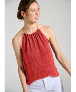 Description\nFlash bare shoulders and arms with a beautifully-cut halterneck. Crafted in a slubby linen and jersey blend, Aster is a joy to wear in hot weather with shorts or for a tonal outfit - our Candace skirt. A self-tie style with gathering into the neck and a relaxed fit, the back is subtly elasticated to help keep it in place.\n\nMade in Europe\nCrafted in a linen and jersey blend\nRelaxed fit\nSelf tie neck\n\n\nSustainable Attributes:\n  Low Water Use  Natural fibres  Ethically made  Vegan   Low Carbon \nDetails\nModel is 5'10 (177cm) and is wearing a UK 10100% Linen Delicate Machine Wash - 30°Product code: TP40783-RICCentre back to hem - 35cm (13 3/4)